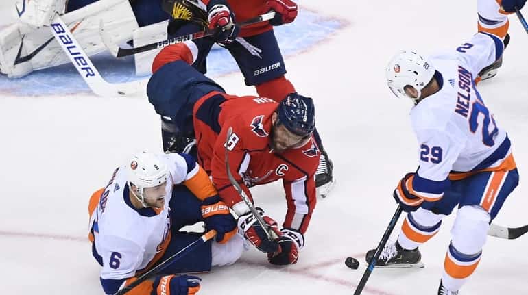 Washington Capitals left wing Alex Ovechkin (8) dives for the...