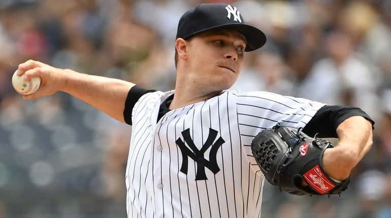 Yankees starting pitcher Sonny Gray delivers against the Indians during...