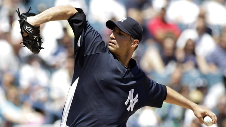 New York Yankees pitcher Andy Pettitte (46) delivers apitch to...