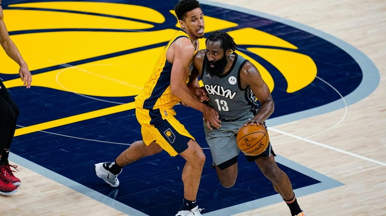 Brooklyn Nets guard James Harden (13) drives on Indiana Pacers...