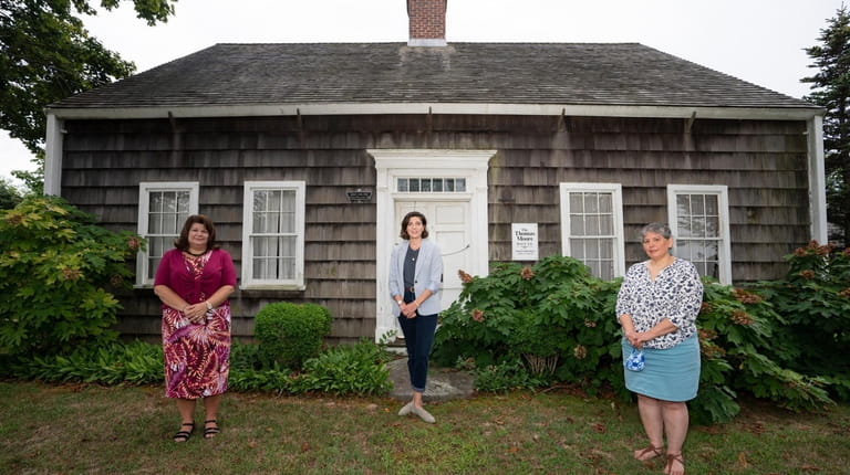 Amy Folk, far right, curated the Southold Historical Society exhibit...