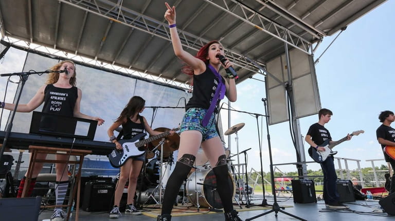 Noelle Stegner of Northport, 14, performs with her band, Tomorrow's...