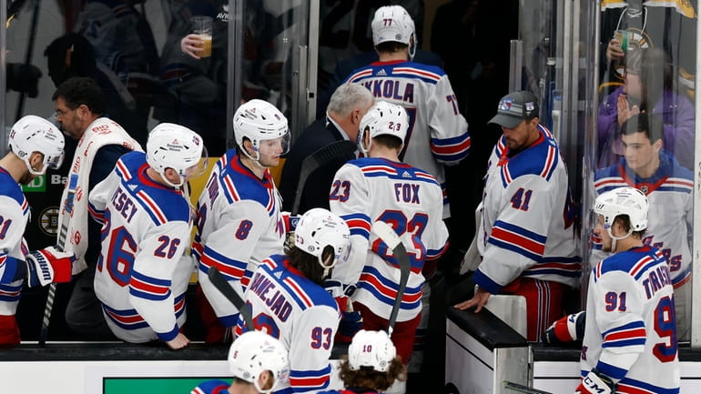 The Rangers leave the ice after losing to the Bruins during...