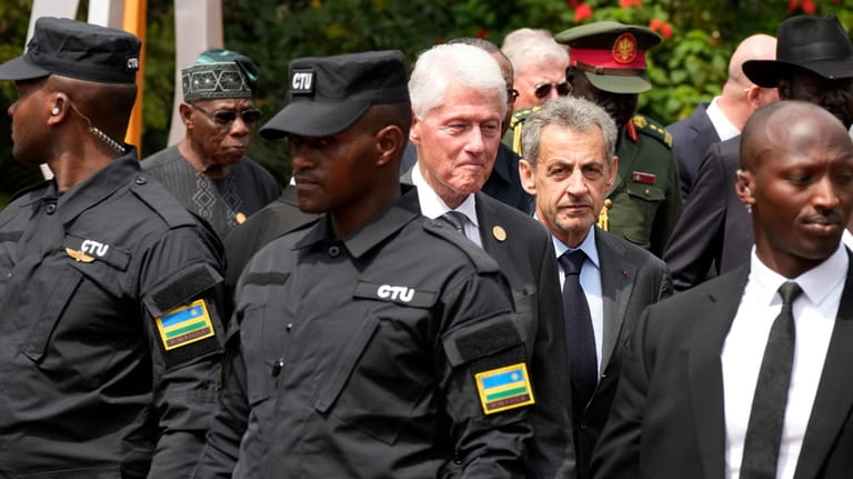 Former US President Bill Clinton, center left, and former President...