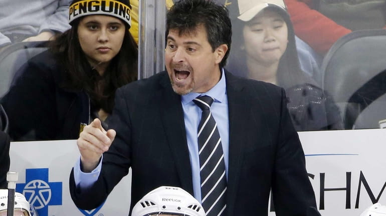 New York Islanders head coach Jack Capuano gives instructions during...
