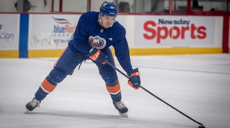 Islanders' Michael Dal Colle shooting to the goal during practice...