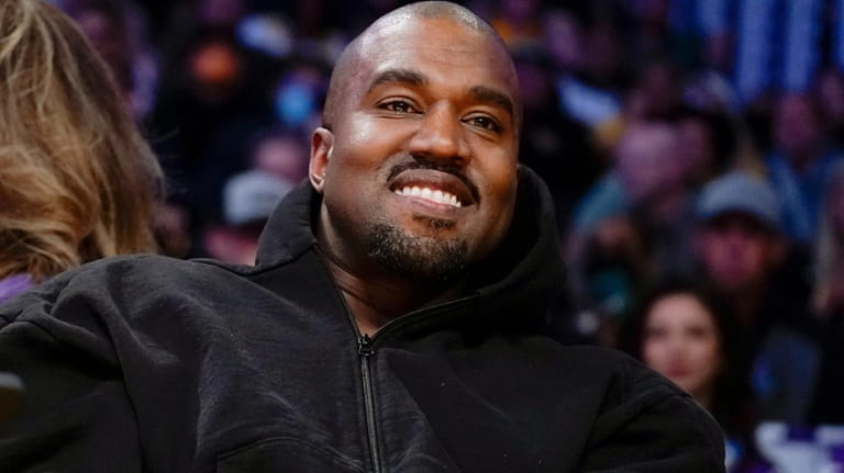 Kanye West, known as Ye, watches the first half of...
