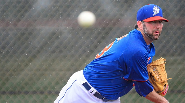 Mets' Shaun Marcum delivers a pitch during a spring training...