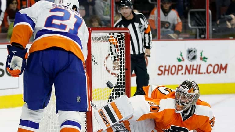 New York Islanders' Kyle Okposo scores a goal against Philadelphia...