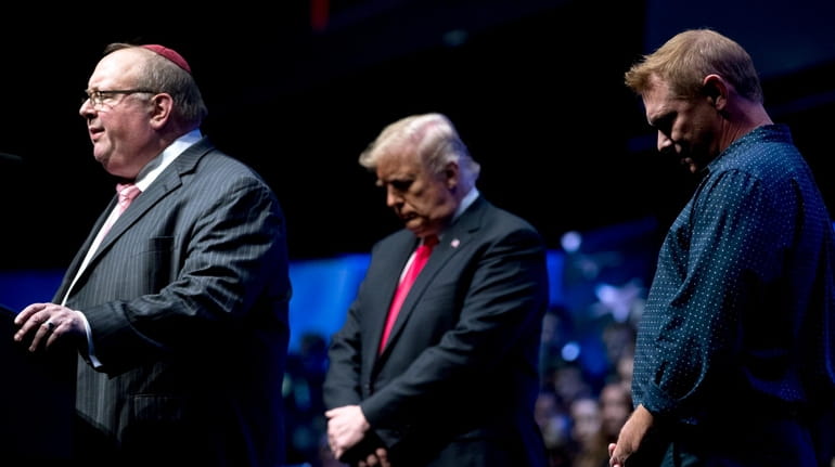 From left, Rabbi Benjamin Sendrow,  President Donald Trump and Pastor...