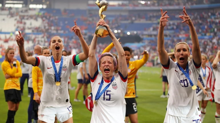 Megan Rapinoe of the USA celebrates with the FIFA Women's...