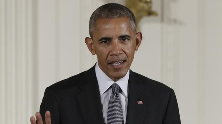 President Barack Obama speaks in the East Room of the...