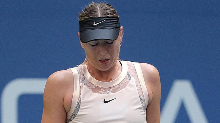 Maria Sharapova reacts to an unforced error against Anastasija Servastova...