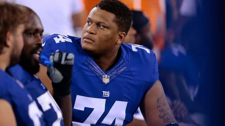 Giants offensive lineman Ereck Flowers is seen on the bench...