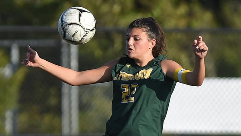 Tyla Vuotto of Lynbrook settles a ball at midfield during...