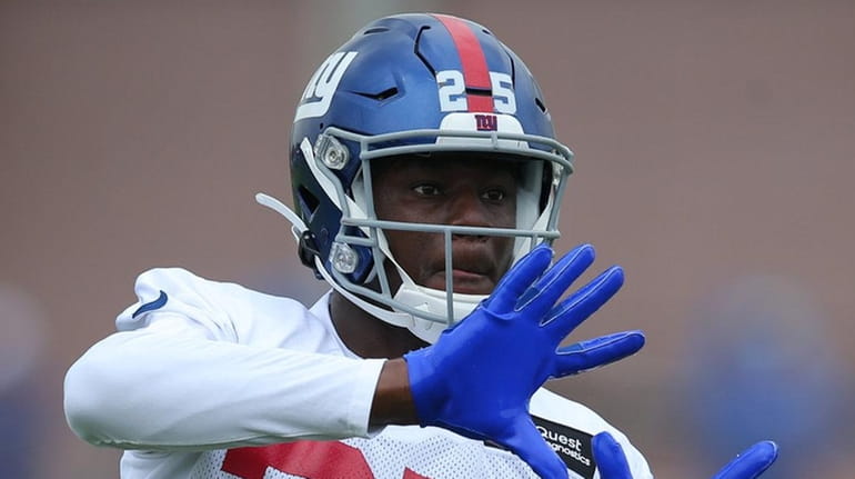 Giants defensive back Corey Ballentine catches a ball during drills during...