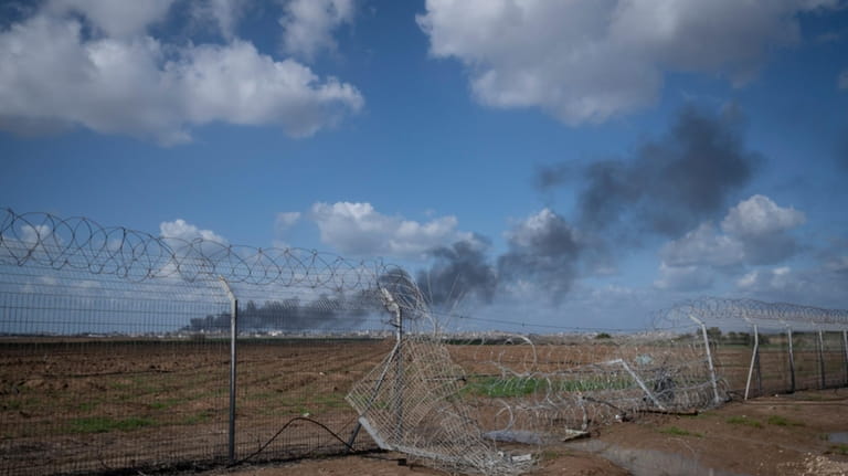 Smoke rises from the north of the Gaza Strip on...