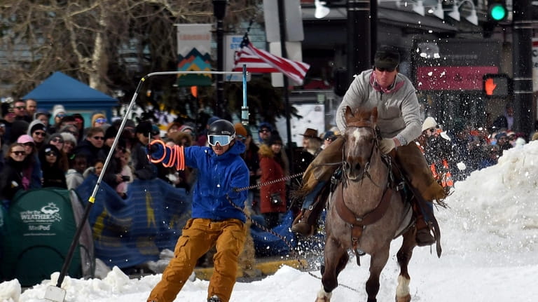 A skijoring team competes in Leadville, Colo., on Saturday, March...