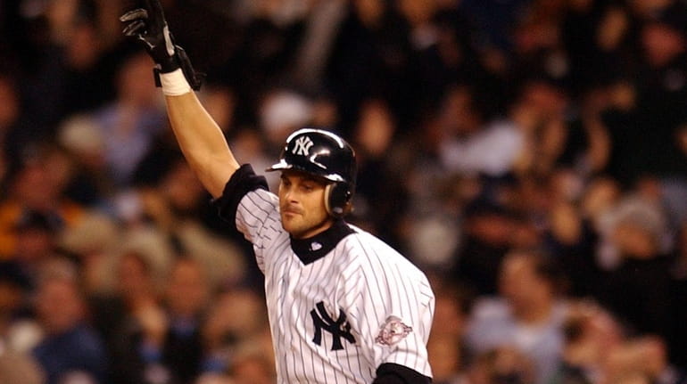 Aaron Boone rounds the bases after hitting a walkoff home run...