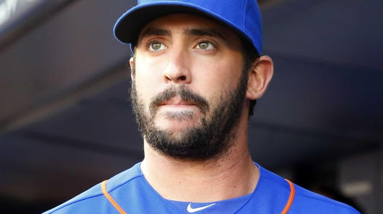 Matt Harvey of the Mets looks on before a game...
