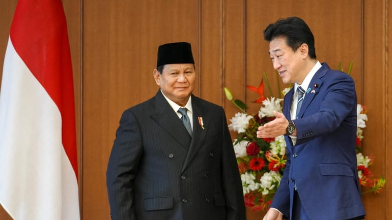 Indonesian Defense Minister and President-elect Prabowo Subianto, left, is shown...