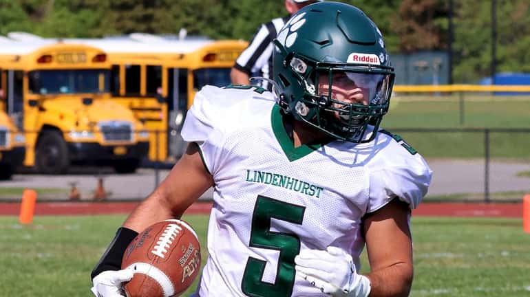 Lindenhurst RB Dominick Artale takes the handoff to the outside...