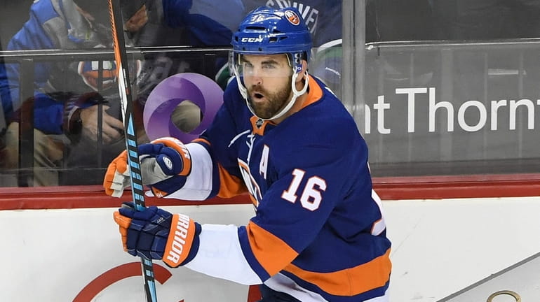 Islanders left wing Andrew Ladd reacts after scoring against the...
