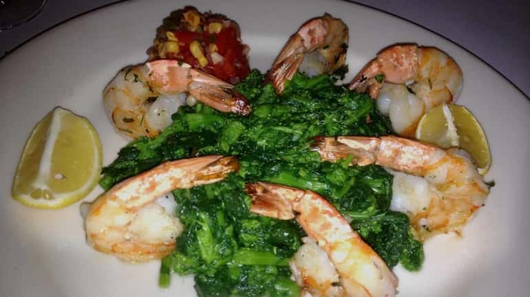Grilled shrimp with broccoli rabe and pico de gallo is...