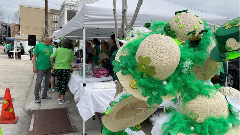 An array of hats decorated for St. Patrick's Day is...
