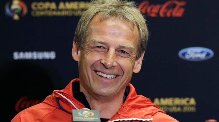 FILE - Then-U.S. men's soccer coach Jurgen Klinsmann talks to...