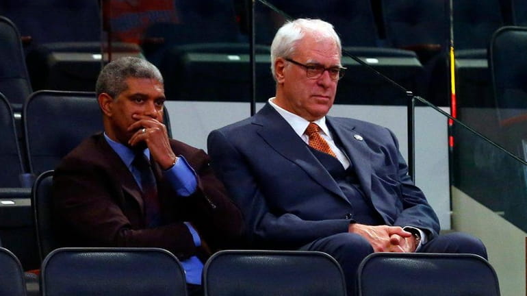 New York Knicks president Phil Jackson, right, looks on late...