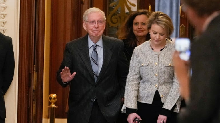 Senate Minority Leader Mitch McConnell of Ky., walks off the...