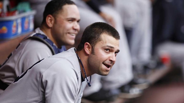 Nick Swisher #33 and Russell Martin #55 of the New...