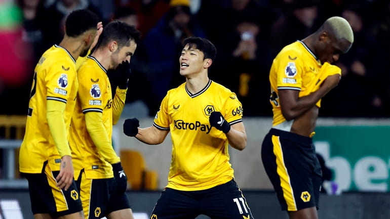 Wolverhampton Wanderers' Hwang Hee-Chan celebrates scoring his side's first goal...