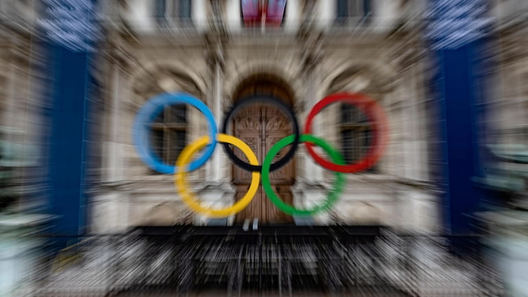 FiILE - The Olympic rings are seen in front of...