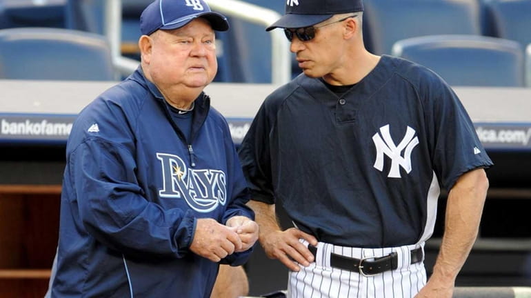 Tampa Bay Rays coach Don Zimmer, left, and Yankees manage...