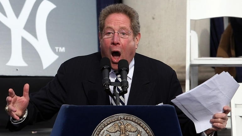 John Sterling speaks during the Yankees' World Series victory celebration at...