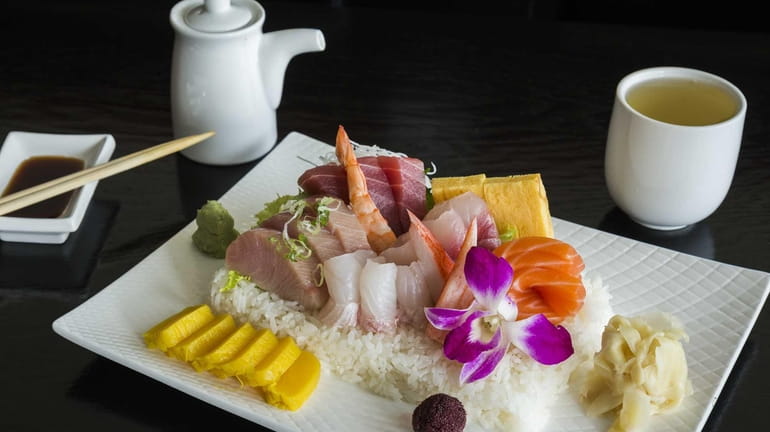 Hazuki Japanese Fusion's chirashi, with finfish and tamago arranged on...