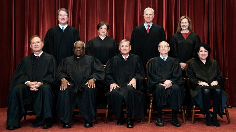Members of the Supreme Court: Seated from left are Associate Justice...