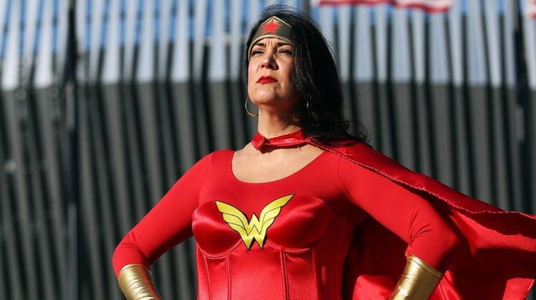 Angela Lisa of East Norwich cosplays as Wonder Woman in...