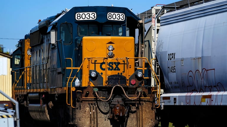 A CSX train engine sits idle on tracks in Philadelphia,...