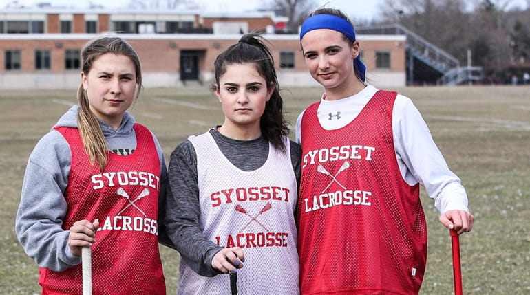 From left, Syosset girls lacrosse players Melissa Esswein, Rebecca Korn...