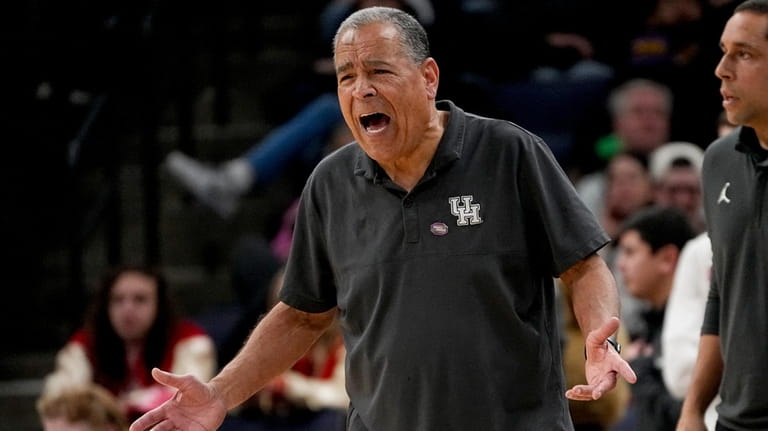 Houston head coach Kelvin Sampson yells to his players during...