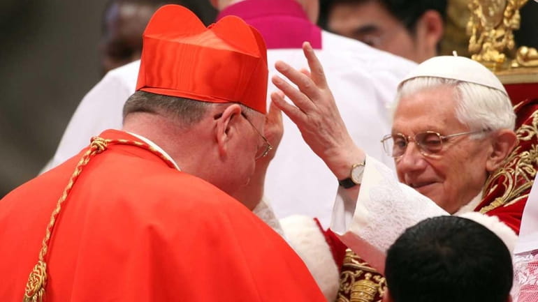 New cardinal Timothy Michael Dolan (L), Archbishop of New York,...