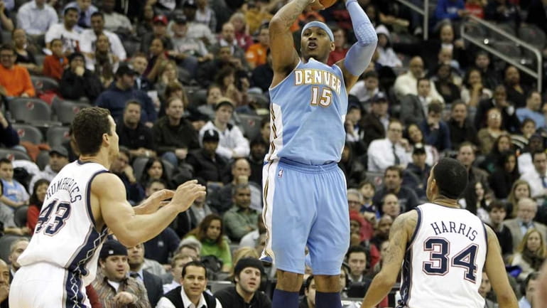 Denver Nuggets small forward Carmelo Anthony (15) shoots over New...