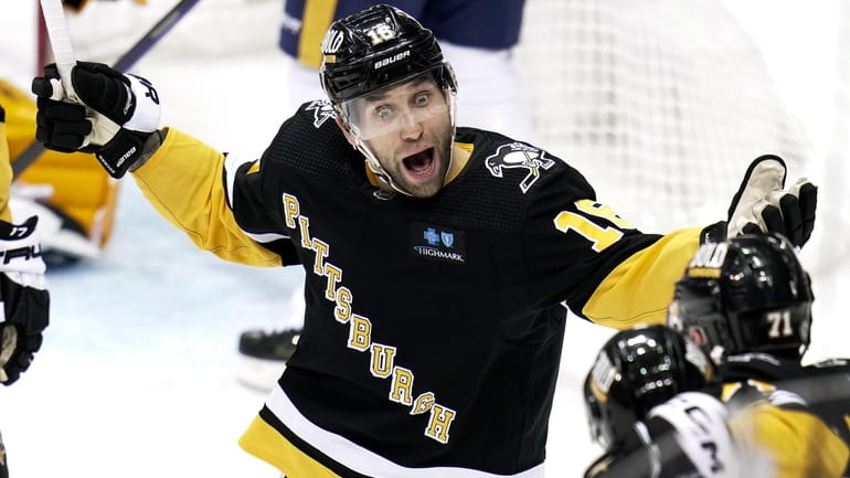 Pittsburgh Penguins' Jason Zucker (16) celebrates his goal against the...