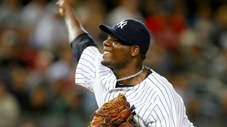 Michael Pineda #35 of the New York Yankees pitches against...
