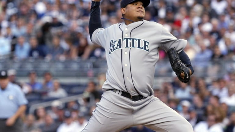 Seattle Mariners' Felix Hernandez pitches during the first inning of...