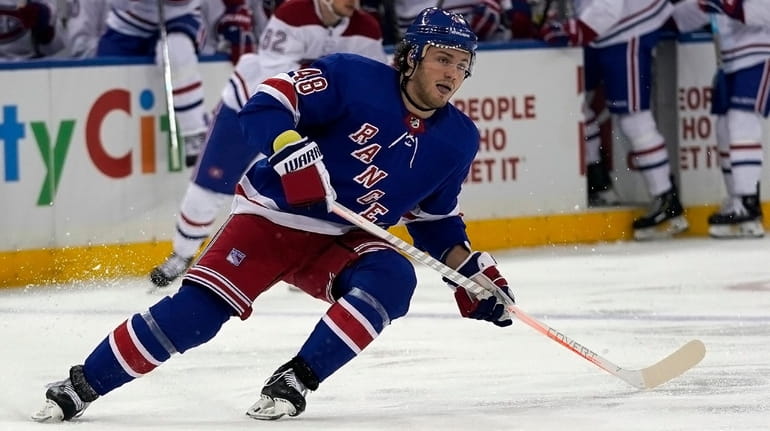Rangers left wing Brendan Lemieux skates to the puck during...