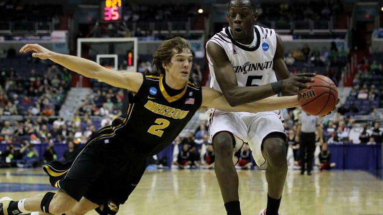 Ricky Kreklow #2 of the Missouri Tigers tries to steal...